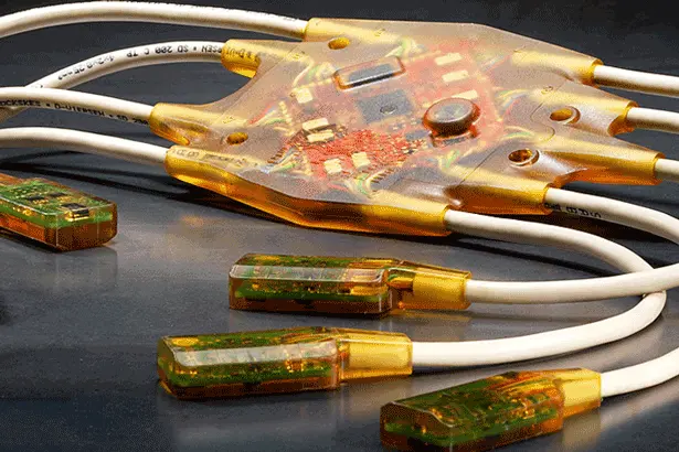 Low pressure molding application on electronic components